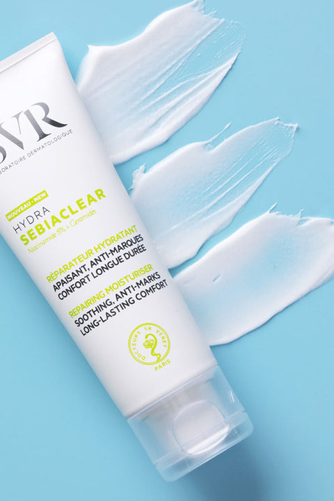 SVR Sebiaclear Hydra moisturizer tube with white cream swatches on a light blue background.
